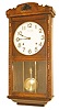 Japanese box clock, 23" high walnut case with ripple molding on the door.