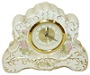 "Made In Germany", miniature porcelain clock, 6" wide, 4.25" high.