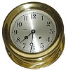 Chelsea Ships Bell clock in a polished brass case, 7.25" across the bezel, and 7.5" across the base.