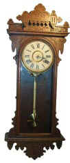 Ansonia Clock Co., "Rio" ca. 1904. Fancy 39 inches high oak case, refinished at one time, small tip missing back side. — Antique Clocks Price Guide