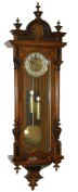 German Vienna regulator, very unusual, in a good walnut veneer case that is unusually tall at 53 inch. — Antique Clocks Price Guide
