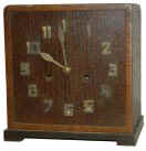 Looks Mission with the brass numerals on wood face, brass hands. — Antique Clocks Price Guide