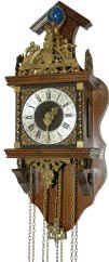 Contemporary Zandam clock, a miniature version of an early Dutch wall clock. — Antique Clocks Price Guide