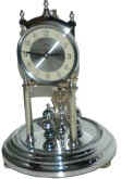 Kundo 400 day clock in a bright silver-chrome case. — Antique Clocks Price Guide