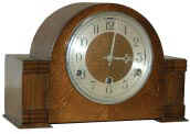 This English oak clock has more eye appeal than the previous. — Antique Clocks Price Guide