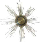 "Made In Germany, 8 day" time only, in an art deco Sunburst design. — Antique Clocks Price Guide