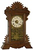 We don't know who made this parlor clock, but it was made for the Portuguese market.