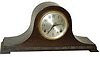 Seth Thomas tambour, mahogany case with trim molding around the base, otherwise plain.