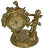 Golden Novelty Co. small clock with cupid, excellent finish on the 5.5 inch case. 