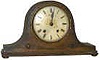 Empire, Made in England, small oak tambour clock.