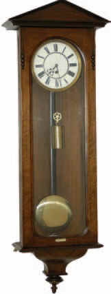 German one weight Vienna Regulator in a dark walnut case, 41 inches tall. We believe the headpiece to be original to this case. — Antique Clocks Price Guide