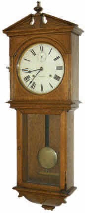 Seth Thomas wall clock, "Umbria", ca 1909. 40.5 inches case was made of old oak and is retaining its original finish with the exception of routine polishing. — Antique Clocks Price Guide
