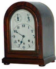 German Mauthe bracket clock, 8 day striking Westminster chimes on 5 chime rods each quarter hour. The 13 inches high mahogany case made the trip from Oregon without suffering any damage. — Antique Clocks Price Guide