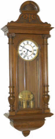 Gustav Becker Vienna Regulator in a 3/4 size walnut case that was restored years ago. As headpieces go, this one is different, carved and etched, and we feel is original to this case. — Antique Clocks Price Guide