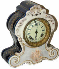 Ansonia Clock Co. porcelain clock with unusual colors or cream front and cobalt blue on the back and sides. — Antique Clocks Price Guide