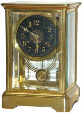 French crystal regulator. The 9.5 inches tall brass case has been polished, the 8-day movement clean and running well. — Antique Clocks Price Guide
