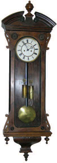 Lenzkirch wall Vienna two-weight regulator. Fancy 52 inches high walnut case is in good condition. — Antique Clocks Price Guide