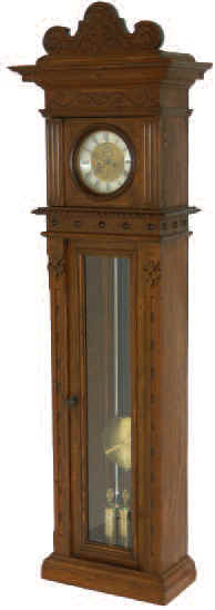 German Vienna (movement) tall clock, in a walnut finished pine double door case. There is considerable carving on all the front surfaces of the case and original headpiece. — Antique Clocks Price Guide