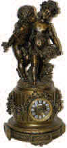 French mantle clock. This is a large metal clock base and with large metal cherub statues. — Antique Clocks Price Guide