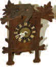 German mini cuckoo with a music box alarm. — Antique Clocks Price Guide