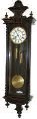 German Vienna Regulator, 2 weight, 8 day, striking a coil gong on the half hours and hours. — Antique Clocks Price Guide