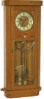 Gustav Becker two weight movement, ca 1886, serial number No. 599900, now in a ca1920 golden oak case with 8 panes of heavily beveled glass in a brass frame. — Antique Clocks Price Guide