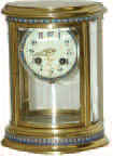 French oval crystal regulator trimmed in cloisonne. — Antique Clocks Price Guide