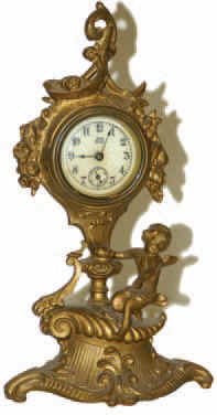 Jennings Bros. metal novelty clock that stands 9.5 inches high. — Antique Clocks Price Guide