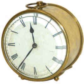 French brass tin can clock, 4 inches high plus the loop handle. Rests on two ball feet. — Antique Clocks Price Guide