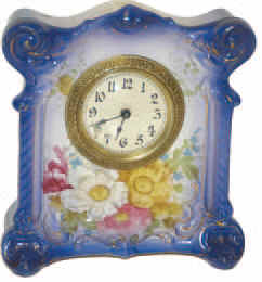 German miniature porcelain clock, 6 inches tall. — Antique Clocks Price Guide