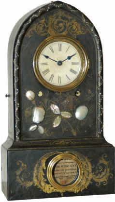 Cast iron beehive with mother of pearl inlay and elaborate gold leaf decoration, faded in some areas. — Antique Clocks Price Guide