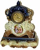 English 2 piece porcelain clock. The base of the case is marked, "England", with a crown.