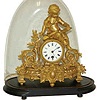 French statue clock under a glass dome. Dome on base is 16.5 inches high, 14.5 inches wide.