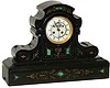 French black marble with green malachite inlay and gold-filled engravings brightly displayed over the front of the case.