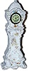 New Haven novelty porcelain clock, made to resemble a clock on a pedestal. Predominately white with a smattering of painted flowers and gold accent.