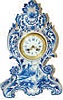 French porcelain clock but case was made in Germany. Blue delft case, 16 inches high, 10.5 inches wide.