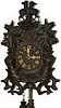 German 30 hour cuckoo in a different looking carved case, 19" high.