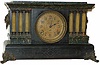 Seth Thomas mantle clock, rare model striking on two cup bells, ca. 1900. The case has an adamantine finish of dark green and black, and is 18 inches wide, 11 inches high.