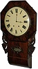 Winterhalter and Hofmeier 8 day movement in an English roll bottom short drop case. 29 inch flame mahogany case with large carved wings on the sides and carving around the lower glass.