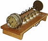 An automatic alarm system called, "Never Fail Time Switch", made by "J.E. Gilson Co. Port Washington, Wis". Patented 1923.