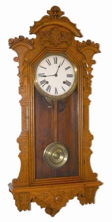 E. Ingraham Clock Co. wall clock, "Pacific", ca 1896. Oak case is 37" high, has been rubbed and polished, now a very desirable light/medium oak. — Antique Clocks Price Guide