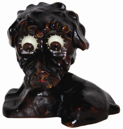 Oswald "Poodle" made of a composition material which dates it to the 1950's. It is a medium sized Oswald, standing 5.5" high, and has a very good original finish. — Antique Clocks Price Guide