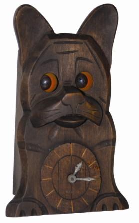 Carved novelty dog with blinking eyes, ca 1930. We have not had the blinking eye dogs before, in fact have not seen one before, and we have two in this collection. — Antique Clocks Price Guide