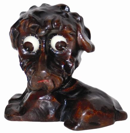 German, Oswald, carved composition poodle, 5.5" high, and in excellent condition. — Antique Clocks Price Guide