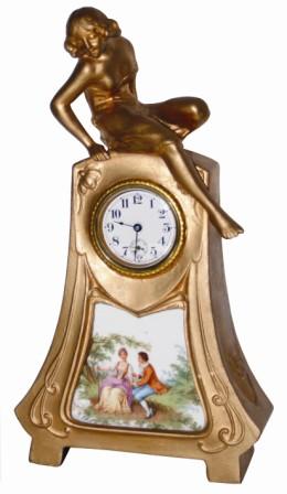 Waterbury Clock Co. art nouveau novelty clock, featuring a female exhibitionist sitting on the clock. — Antique Clocks Price Guide