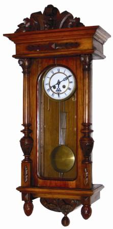 German RA type wall clock. Medium sized walnut case is 33" high, exceptionally nice and clean, carved top, base, columns, and even carved finials. — Antique Clocks Price Guide