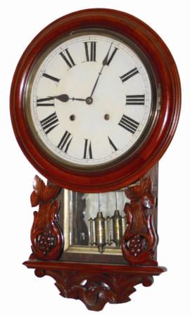English short drop, carved case, ca 1880. Some say this style clock with the bezel pegged to the box behind, may have been made by Welch or Jerome and exported to England. — Antique Clocks Price Guide