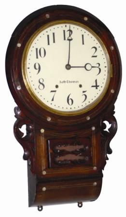Seth Thomas Clock Co. short drop wall clock, English style, pegged case, rounded bottom, inlaid mother of pearl and metal designs. — Antique Clocks Price Guide