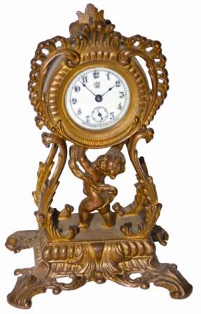 Waterbury Clock Co. novelty clock, "Alma". — Antique Clocks Price Guide