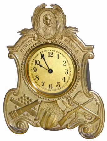 Rare novelty clock, "Dewey - Manila - 1898", all signed on the front of this cast brass case. It stands 10" high, in good clean condition, little if any wear. — Antique Clocks Price Guide